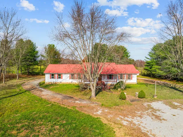 a front view of a house with a small yard