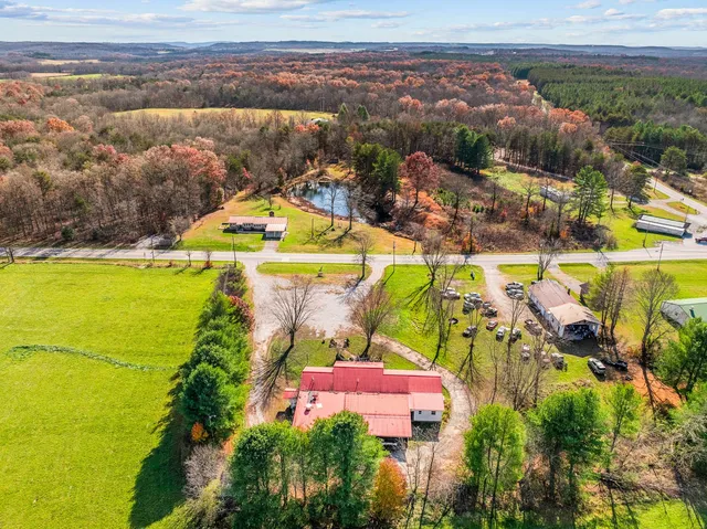 a front view of a house with swimming pool having outdoor seating