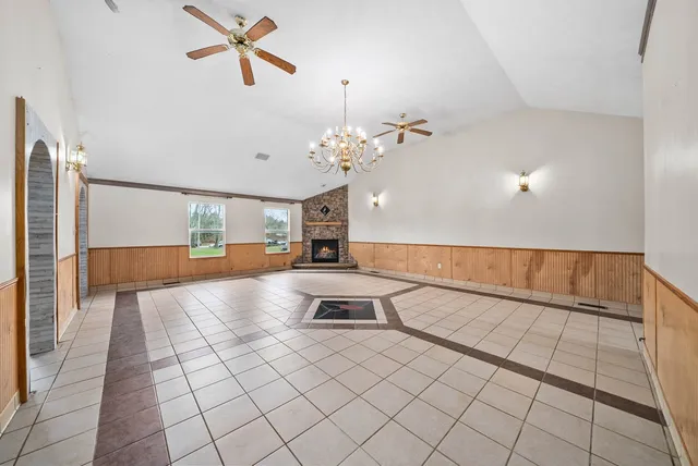 a view of living room with kitchen island furniture and a chandelier