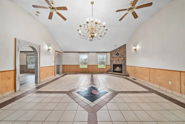 a lobby with furniture and a chandelier