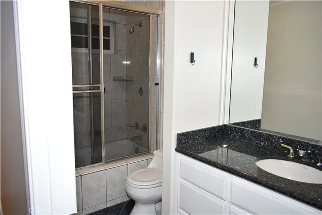 a view of a room with wooden floor and windows