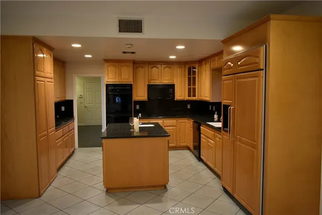 a view of a park with large trees