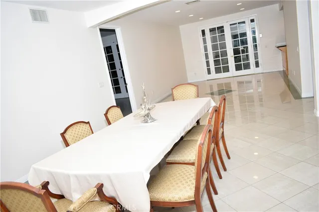 a living room with a large window and a rug