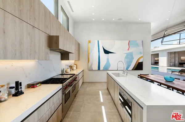 a kitchen with a stove and a sink