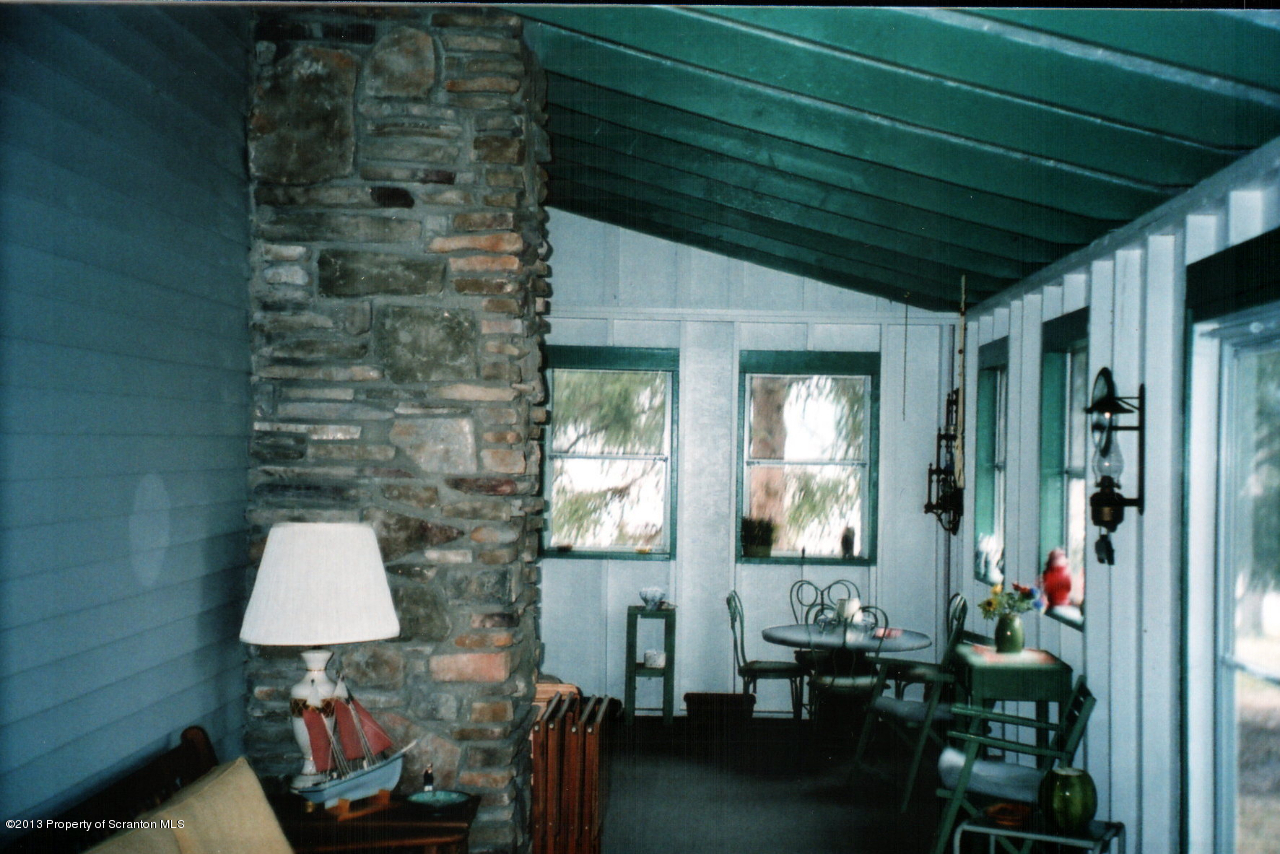 145 Point Road Lake Winola, PA 18419 - Photo 4 of 16 a room with furniture and a window