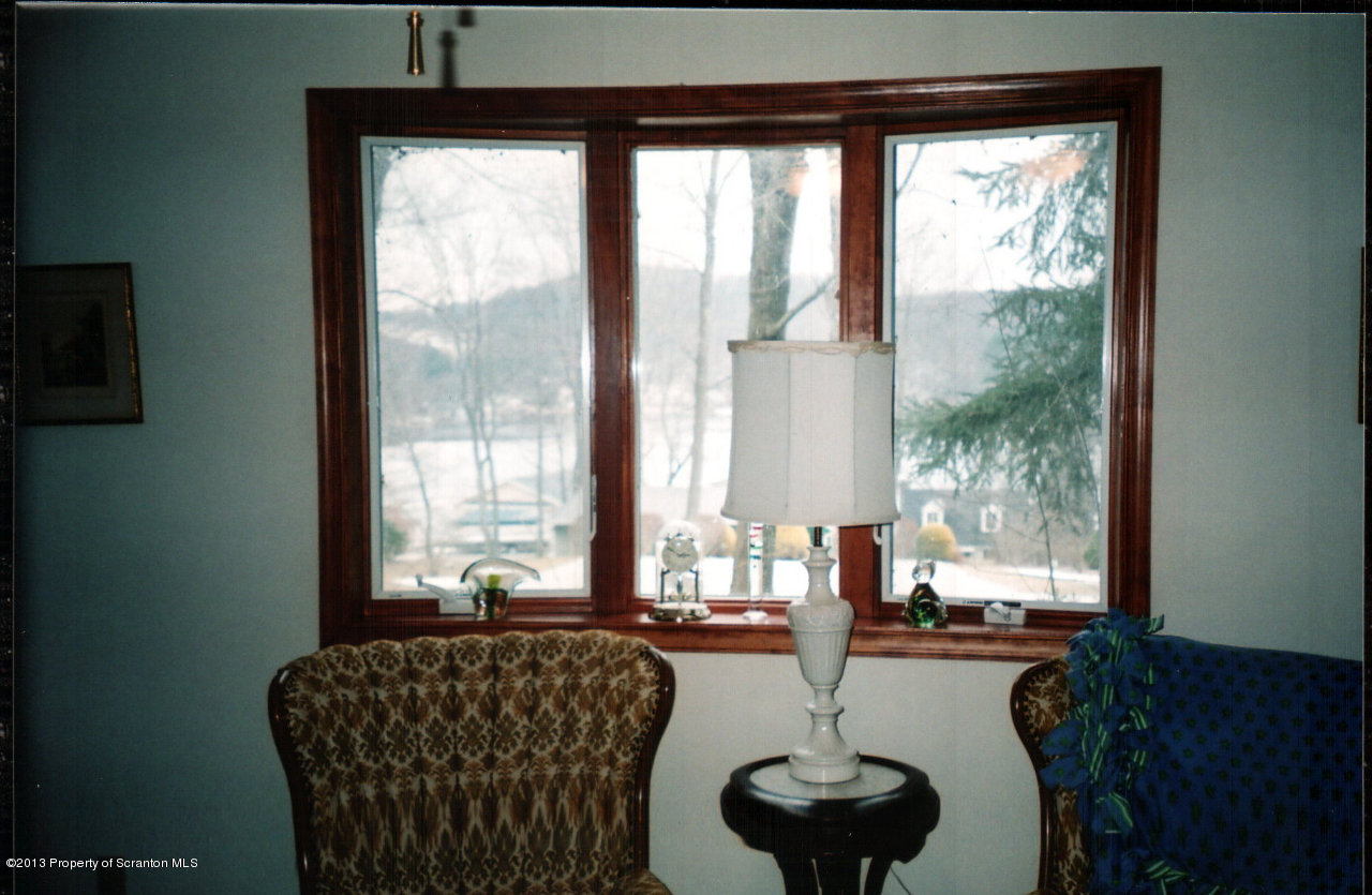 145 Point Road Lake Winola, PA 18419 - Photo 5 of 16 a living room with furniture and a large window