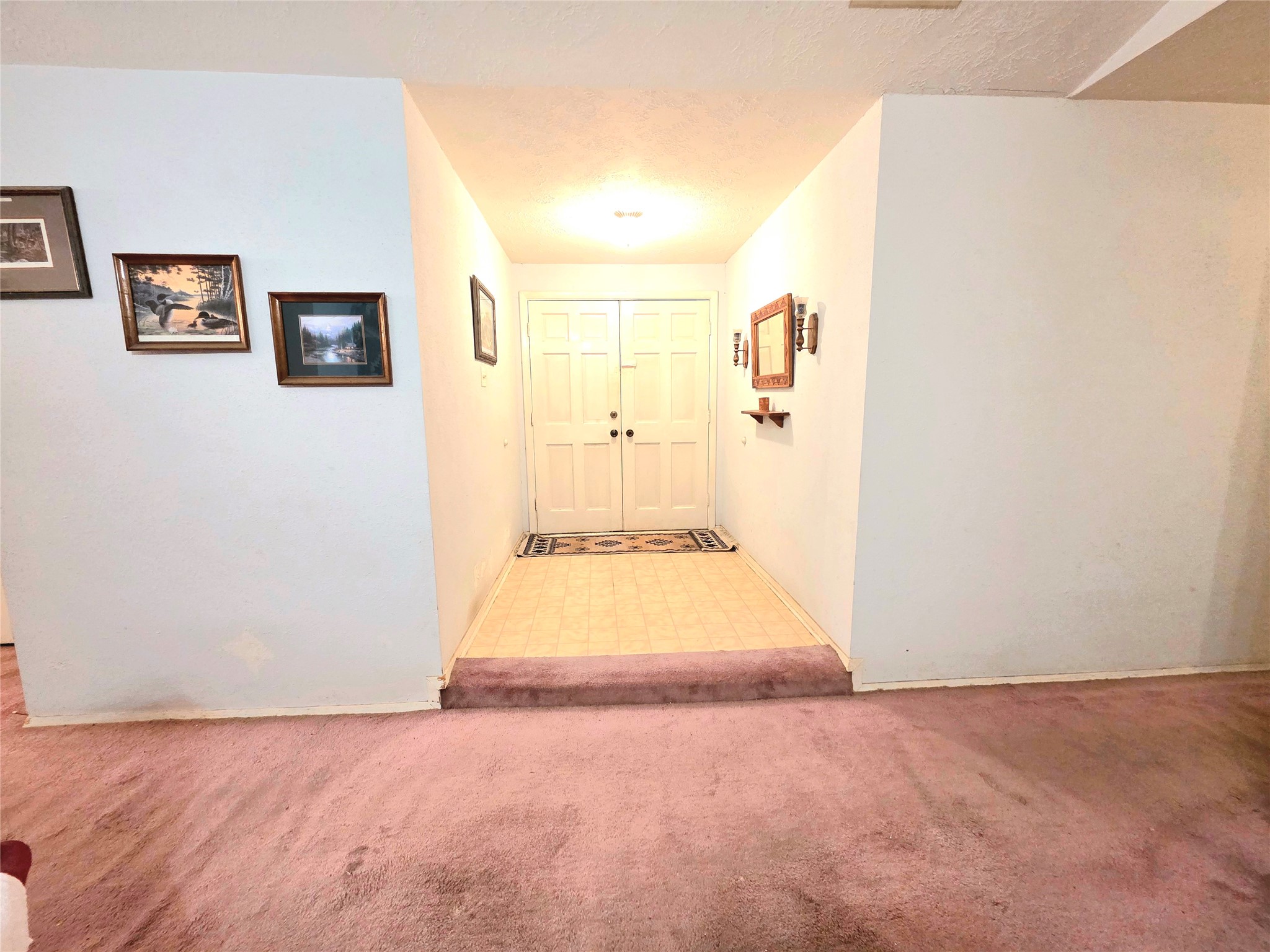 8519 Riverside Walk Lane Houston, TX 77064 - Photo 4 of 10 a view of a hallway with wooden floor and cabinet