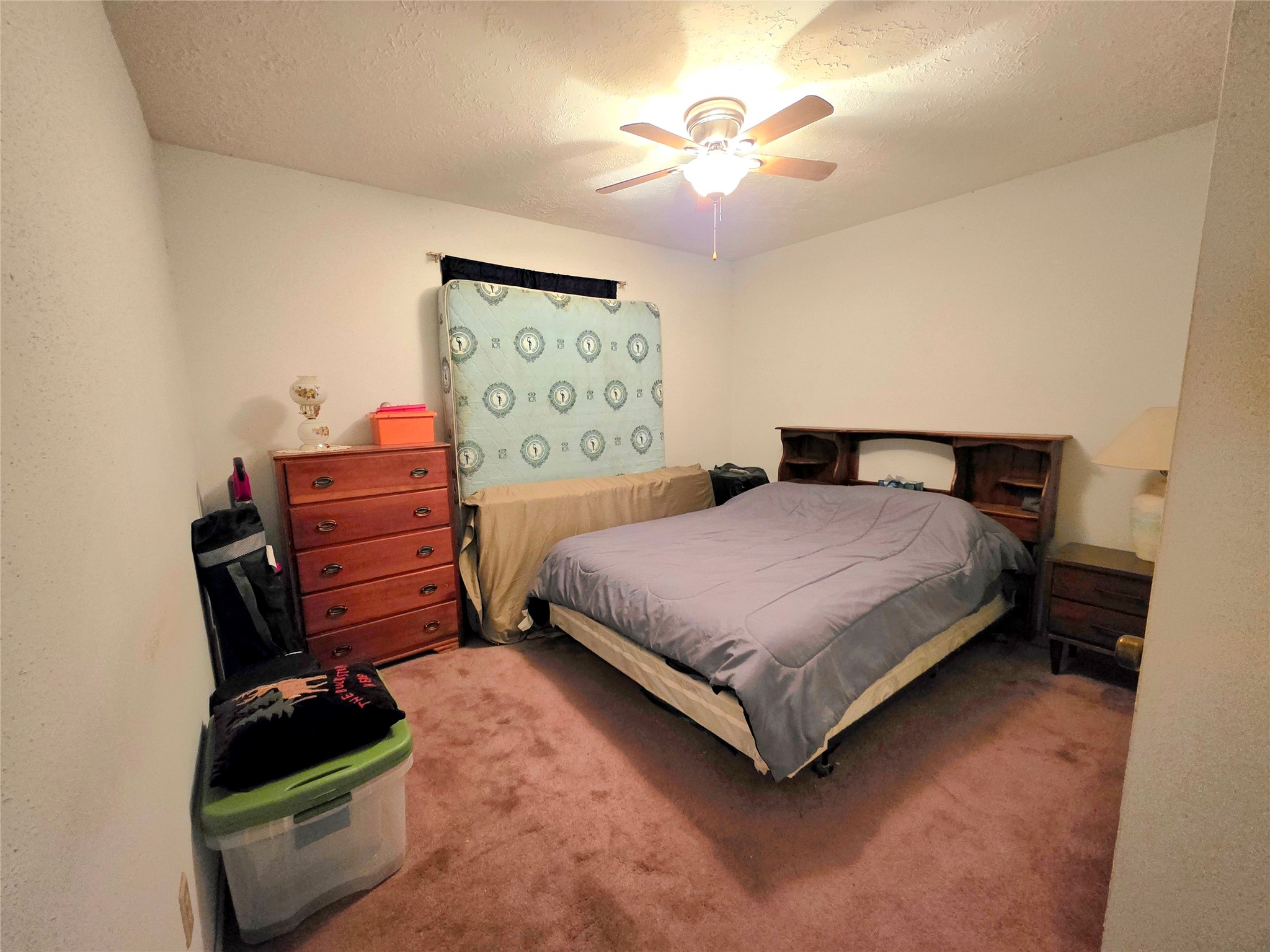 8519 Riverside Walk Lane Houston, TX 77064 - Photo 7 of 10 a bedroom with a bed window and dresser