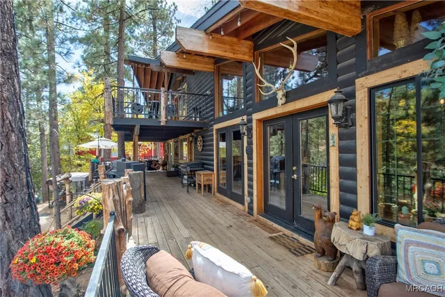a view of a patio with a table and chairs and potted plants