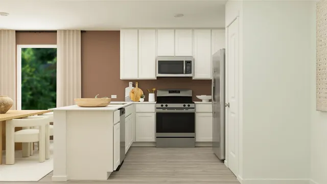 a kitchen with stainless steel appliances granite countertop a sink a stove and a refrigerator