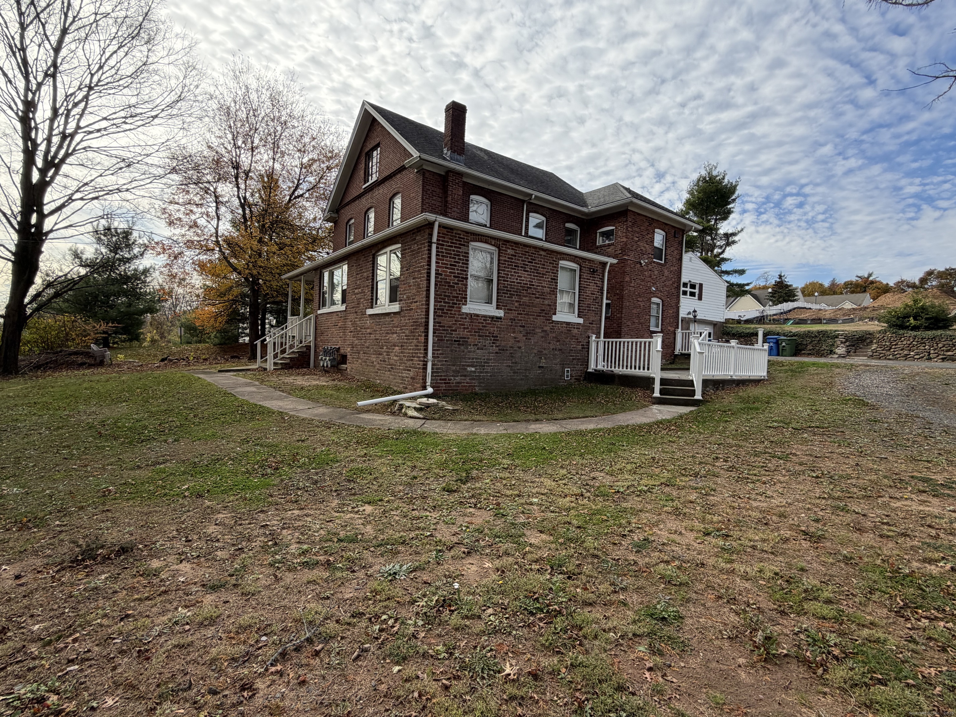 2964 State Street, Unit 1 Hamden, CT 06517 - Photo 1 of 18 a view of a house with a yard