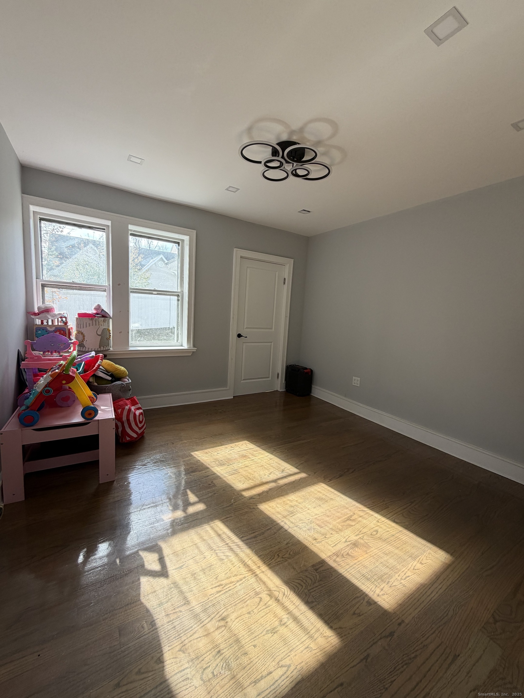 2964 State Street, Unit 1 Hamden, CT 06517 - Photo 12 of 18 a living room with furniture and a window