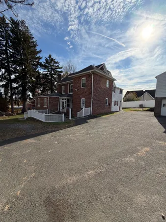 a view of a house with a yard