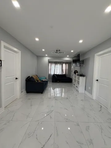 a view of kitchen with stainless steel appliances refrigerator and microwave