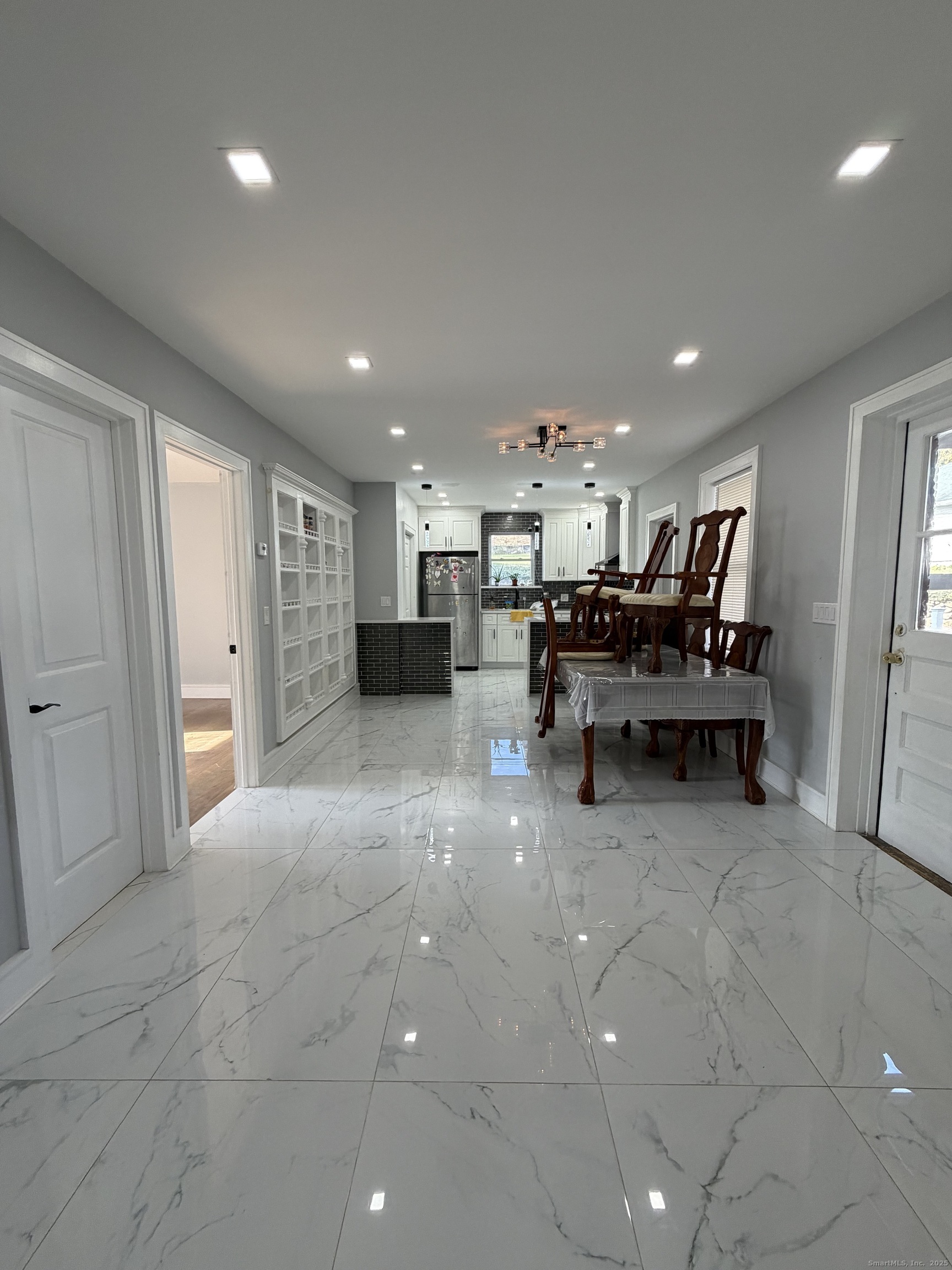 2964 State Street, Unit 1 Hamden, CT 06517 - Photo 7 of 18 a view of a room with chairs