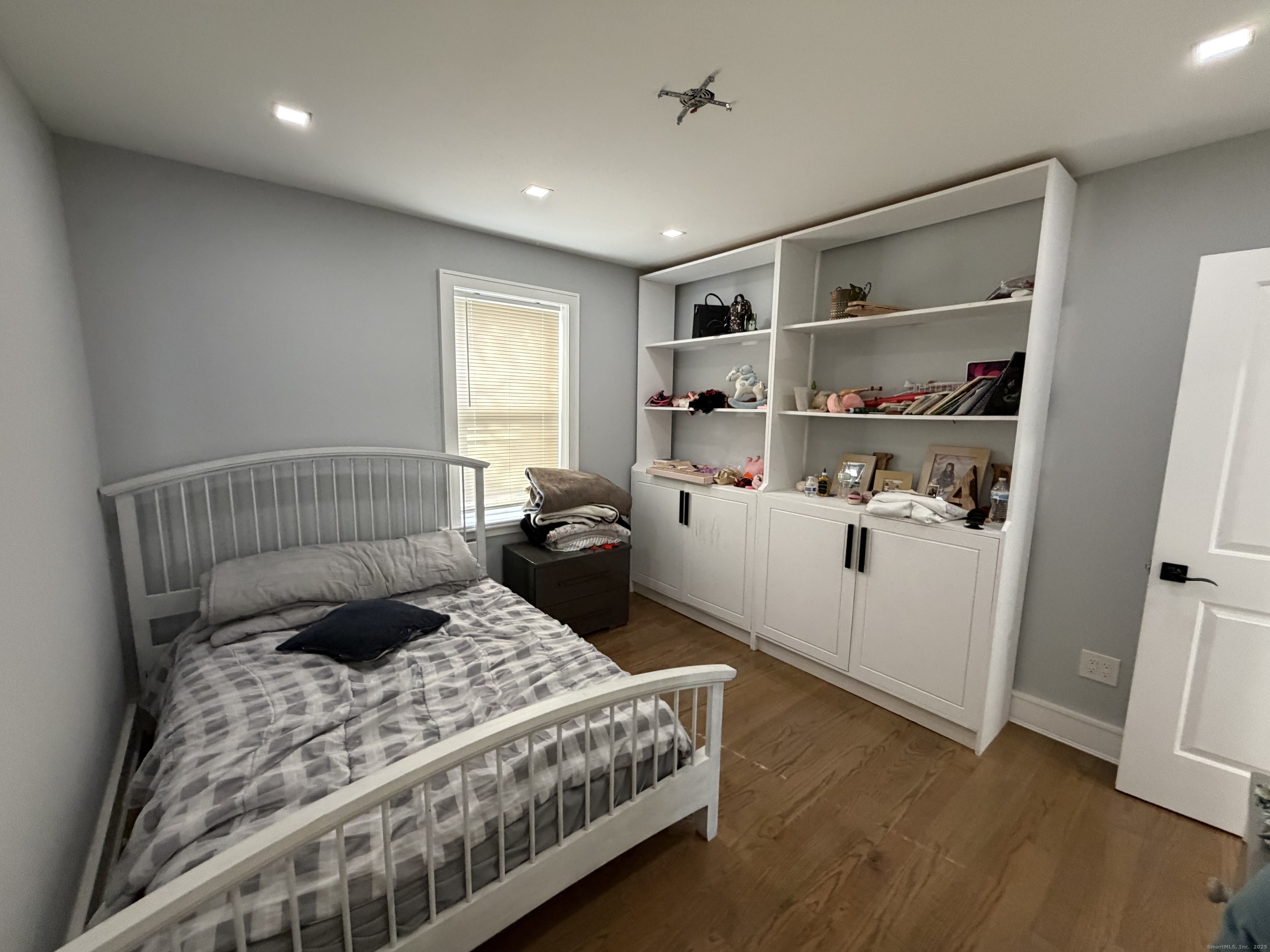 2964 State Street, Unit 1 Hamden, CT 06517 - Photo 10 of 18 a bedroom with a bed and a window