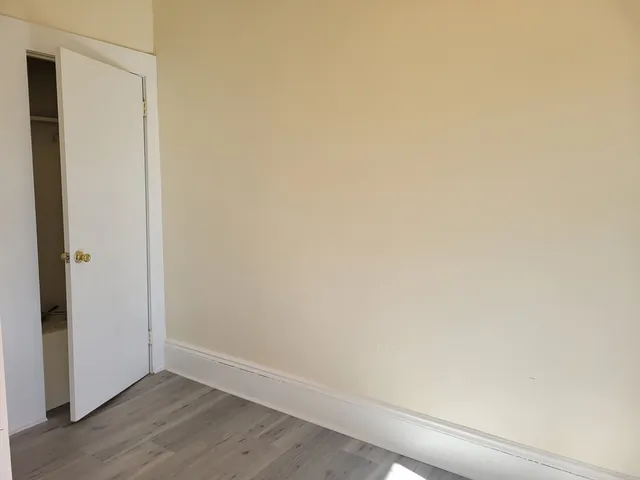 a view of small space with wooden floor