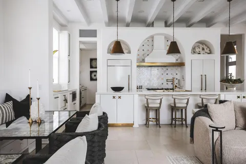 a living room with stainless steel appliances kitchen island granite countertop furniture and a kitchen view