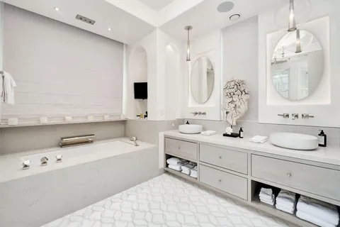 a bedroom with bed and a window