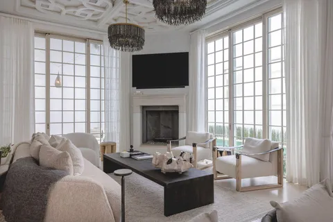a living room with furniture fireplace and flat screen tv