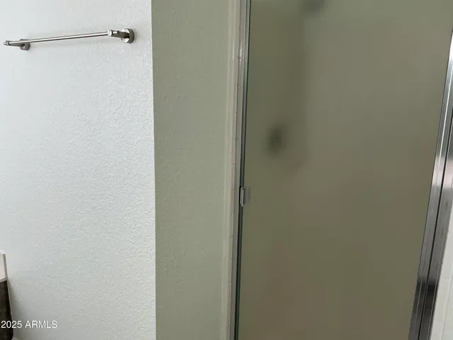 a view of wooden floor and windows in a room