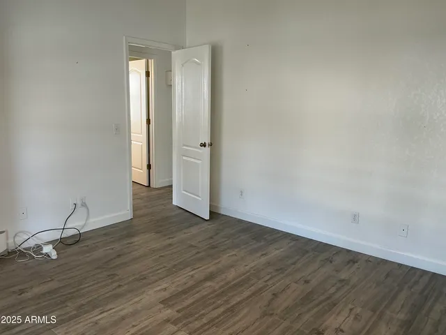 a view of a house with a tree in the background