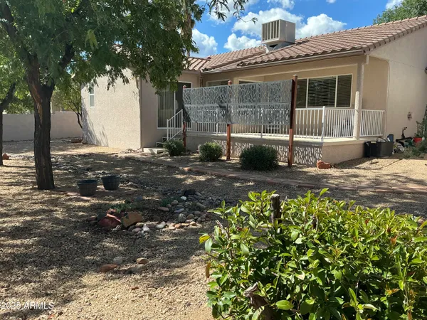 a view of balcony with wooden floor and windows