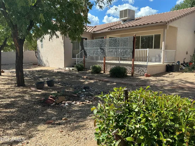 a view of balcony with wooden floor and windows