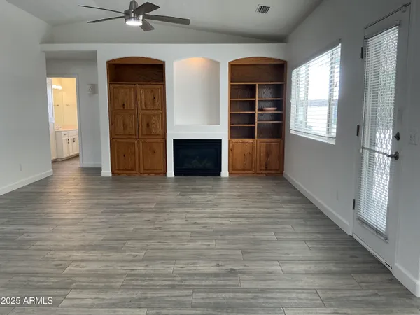 a kitchen with cabinets appliances and a sink