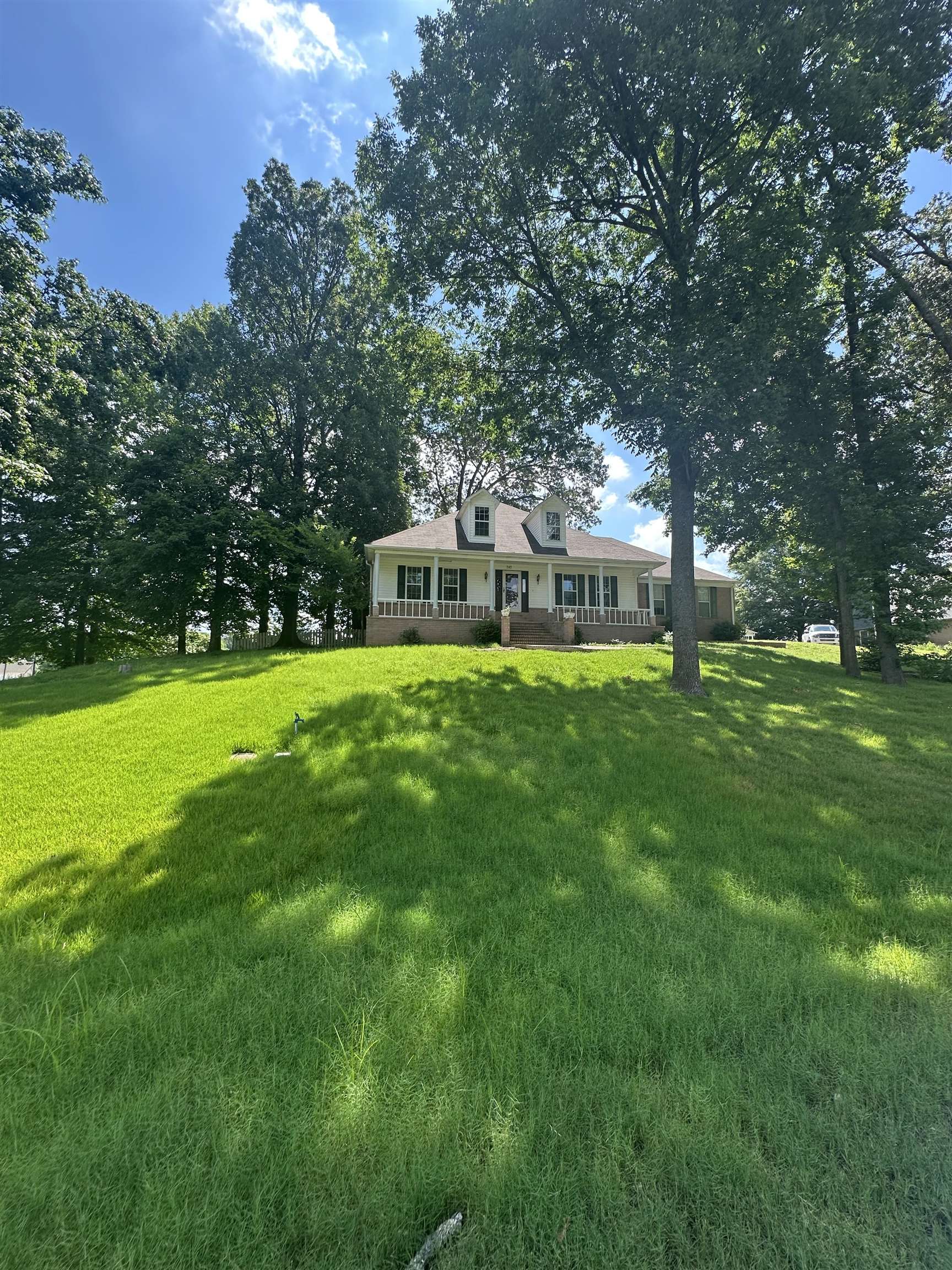 a view of a house with a big yard