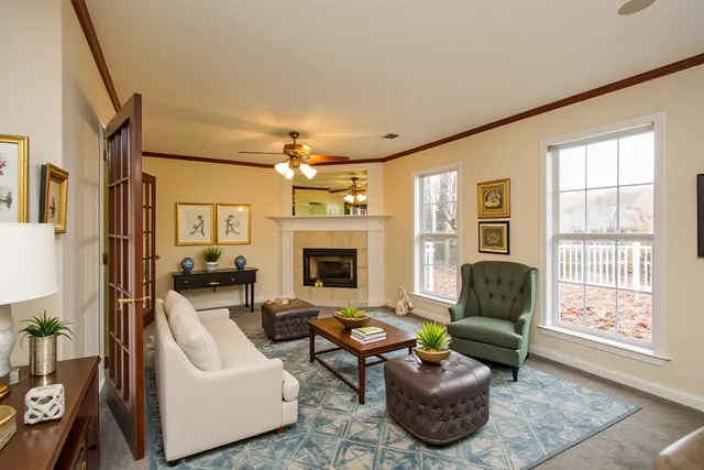 a spacious bathroom with a sink a toilet and a mirror