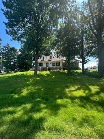a view of a house with a big yard