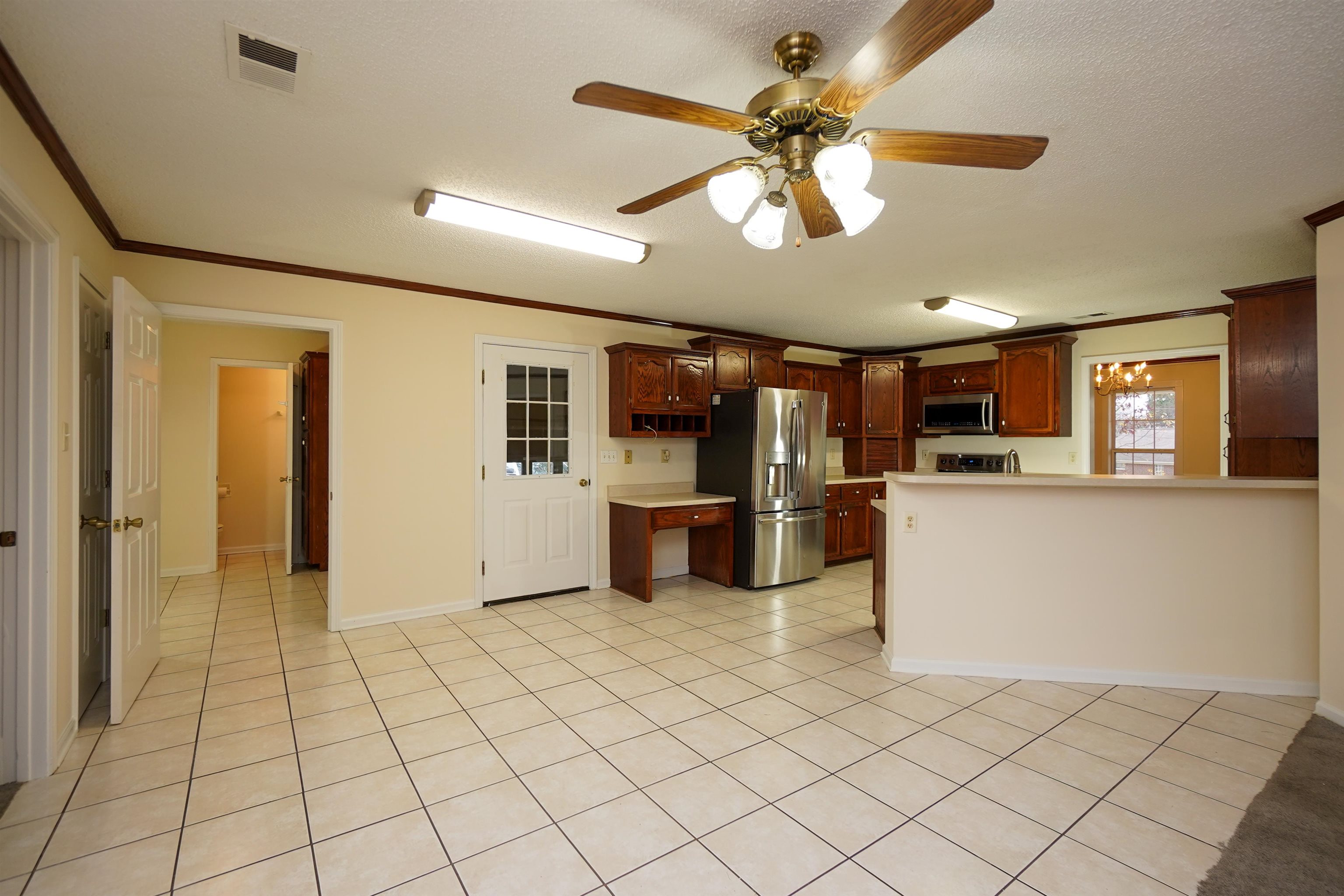 242 Timothy Road Atoka, TN 38004 - Photo 6 of 25 a view of a kitchen with furniture and a window