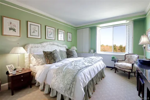 a bed room with a bed and a lamp