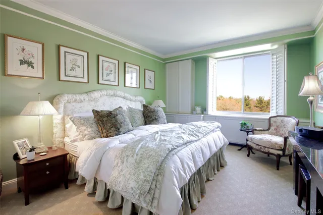 a bed room with a bed and a lamp