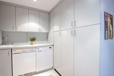 a kitchen with a sink and cabinets
