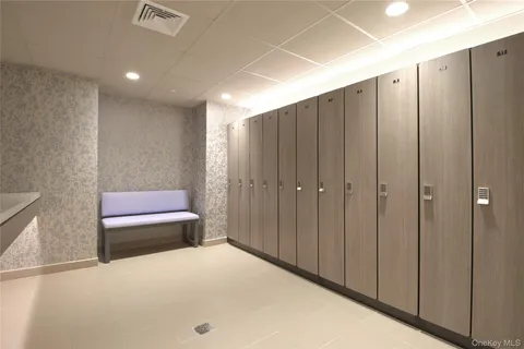 a bedroom with a bed and a cabinet