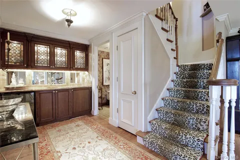 a kitchen with a refrigerator and a stove