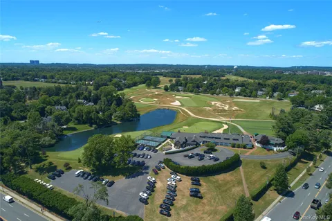 an aerial view of a house with a lake view