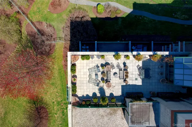 a view of swimming pool with outdoor seating and plants
