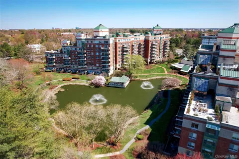 a view of a lake with tall buildings