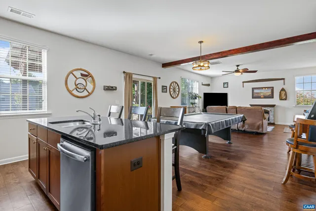 a bathroom with a sink mirror and toilet