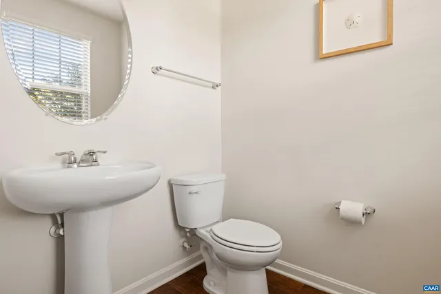 a bedroom with furniture and wooden floor