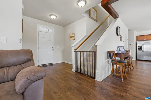 a view of a hallway with a livingroom and a hallway with furniture
