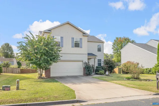 a house with garden in front of it