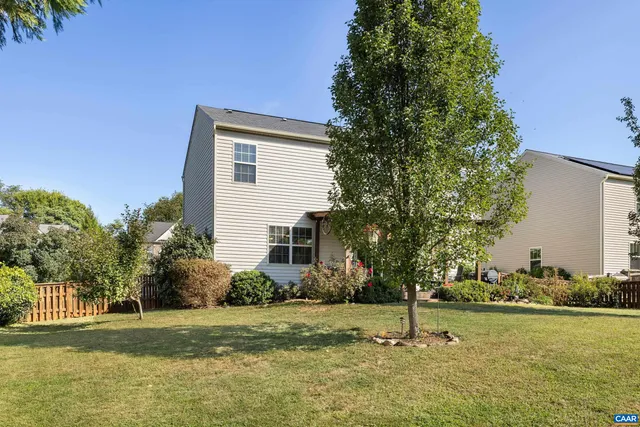 a view of a porch with furniture and a potted plant