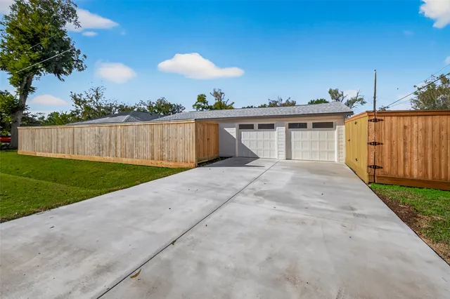 a view of a backyard with potted plants