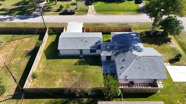 an aerial view of residential houses with outdoor space