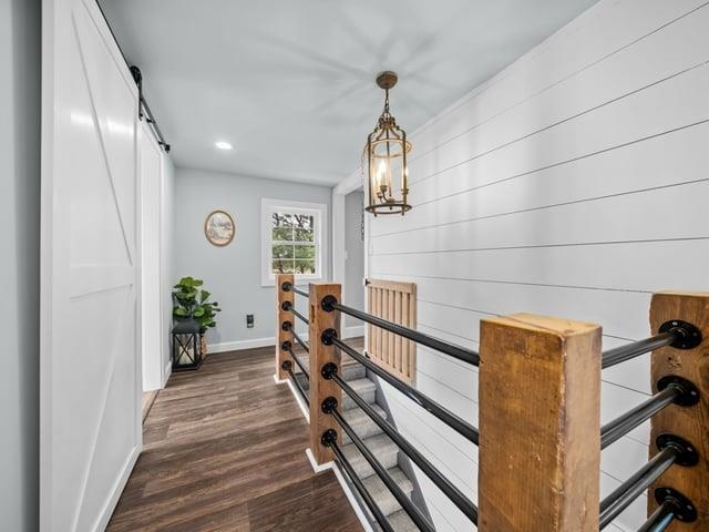 8294 North Leaf River Road Leaf River, IL 61047 - Photo 33 of 56 a view of a hallway with wooden floor and stairs