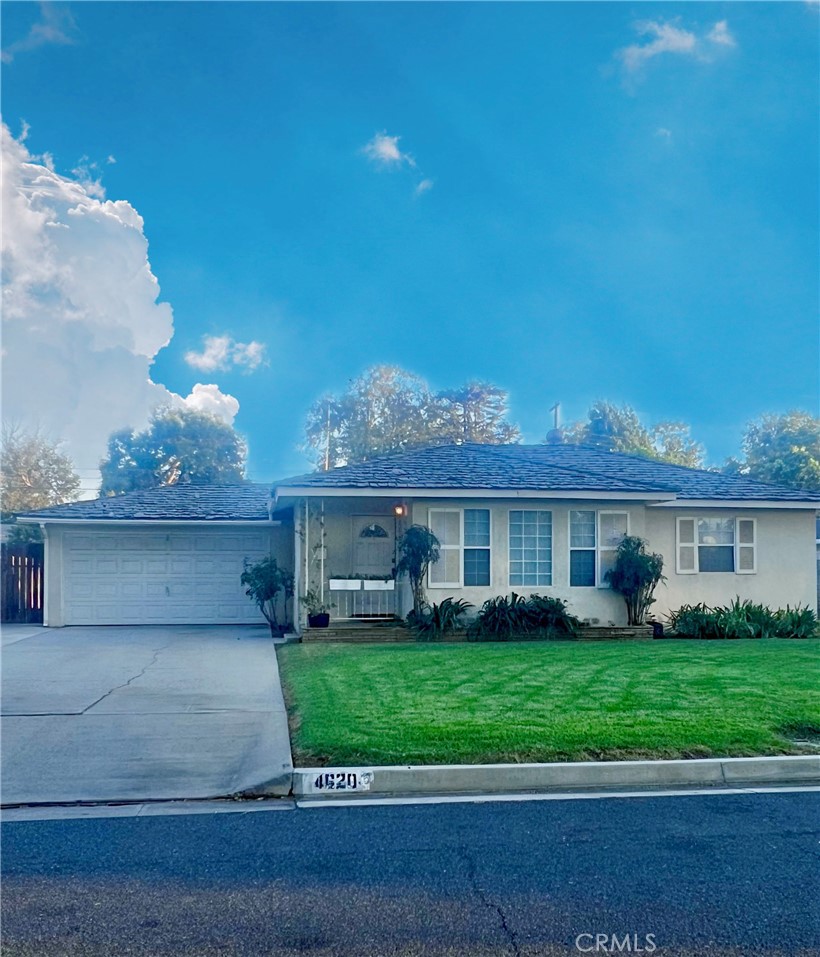 4620 Luther Street Riverside, CA 92504 - Photo 1 of 1 a view of a house next to a yard and large trees